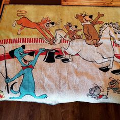 a rug with dogs and cats on it