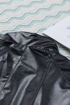 Introducing the Black Faux Leather Moto Jacket. the perfect addition to your wardrobe.This stylish jacket is made from a blend of 55% polyester and 45% PU. making it both durable and comfortable.The classic moto design features a zip-up front. two side pockets. and a stand-up collar for a timeless look.The black faux leather fabric is sleek and sophisticated. making it the perfect jacket for any occasion.Whether you¡¯re heading to the office or out for a night on the town. this jacket will keep Pu Jacket, Faux Leather Biker Jacket, Swimwear High Waisted, Jackets Women, Faux Leather Moto Jacket, Stylish Jackets, Faux Leather Fabric, Leather Biker Jacket, Leather Moto