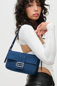 Beverly Purse Dark denim bag. Front flap closure Top zipper Silver hardware Removable, adjustable shoulder strap Removable, adjustable crossbody strap Dimensions: 10" L x 6" H x 2" W Luxury Denim Blue Bag With Zipper Closure, Denim Purse, Denim Bag, Dark Denim, Crossbody Strap, Silver Hardware, Shoulder Strap, Purse, Zipper