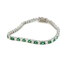 Introducing our captivating Emerald Green and White Stone Tennis Bracelet, meticulously crafted in Italy from exquisite .925 silver and plated in radiant rhodium for a lasting shine. This bracelet embodies the essence of sophistication and elegance, capturing the allure of Italian craftsmanship and the timeless beauty of emerald green stones. Each emerald-green stone, carefully selected for its rich colour and exceptional clarity, is expertly set amidst dazzling white stones within the sleek lin Emerald Green Stone, Silver Tennis Bracelet, Bracelet Tennis, White Stones, Green Stones, Wedding Jewelry Bracelets, White Stone, Green Stone, Tennis Bracelet