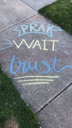 the sidewalk has chalk writing on it that says break wait trust and crayon