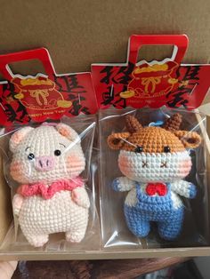 two small crocheted animals in plastic packaging