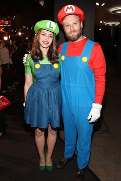 a man and woman dressed up as mario and luigi