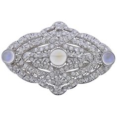 Platinum Art Deco brooch/pendant, set with 3 moonstones - 6.6mm to 8.5mm, surrounded with approx. 3.50ctw in diamonds. Brooch measures 56mm x 36mm. Tested plat. Weight - 21.6 grams. Platinum Element, Cartier Art Deco, Paris Art Deco, Sapphire Brooch, Lalique Jewelry, Tie Ideas, Gold Diamond Watches, Tiaras Jewellery, The Bling Ring