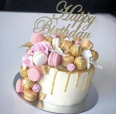 a birthday cake with pink and gold decorations