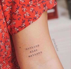 a woman's arm with the words nothing else matters written in cursive font