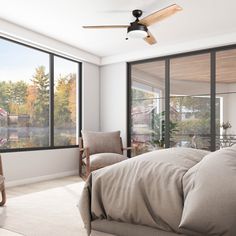 a bedroom with large windows and a ceiling fan