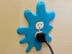 an electric outlet plugged into a blue flower