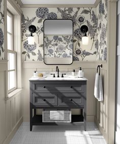 a bathroom with floral wallpaper and two sinks