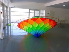 a large colorful object sitting in the middle of a room