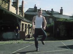 a man riding a skateboard down the middle of a street