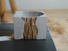 a piece of concrete that has been cut in half and is sitting on a table