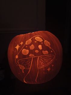 a pumpkin carved to look like a mushroom