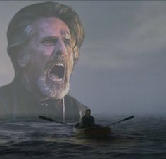 a man in a boat with his mouth open