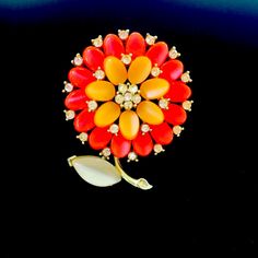 Vintage Gold Tone Orange Flower Brooch Signed Lisner Mid Century Collectible Costume Jewelry Orange Petals Accented With Clear Crystals Center Floral Crystal White Leaf Dimensions: 1 1/2” W X 2” H Crystal White, White Leaf, Orange Flower, Clear Crystals, Orange Flowers, Flower Brooch, Vintage Signs, Clear Crystal, Vintage Gold