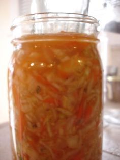 a jar filled with food sitting on top of a table