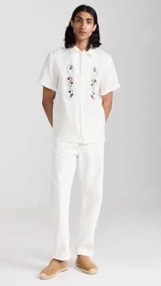 Find DE BONNE FACTURE Linen Embroidered Camp Collar Short Sleeve Shirt on Editorialist. Fabric: Lightweight, non-stretch linen weave. Floral and fruit embroidery at front. Camp collar and button placket. Short sleeves. Shell: 100% linen. Wash cold or dry clean. Made in Portugal. Measurements: Measurements from size M Length: 28in / 71cm Chest: 41in / 104cm Casual Collared Camp Shirt With Floral Embroidery, Embroidered Camp Shirt With Relaxed Fit, Casual Floral Embroidered Collared Camp Shirt, Casual Floral Embroidery Camp Shirt, Casual Embroidered Shirt Traditional Fit, Casual Embroidered Shirt With Traditional Fit, Embroidered Collared White Camp Shirt, Casual Cotton Camp Shirt With Floral Embroidery, White Embroidered Collared Camp Shirt