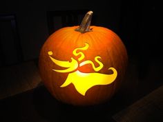 a carved pumpkin with an image of a dog on it