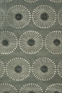 a gray rug with white circles on it