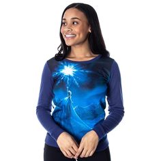 Disney's Frozen is the breakout title that captured the hearts of so many. Queen Elsa and Princess Anna will always be sisters first. Elsa has special powers to manipulate ice and her role as the queen threatens the sisters' relationship. This Sublimated print pullover features Elsa on the front casting her ice spell surrounded by a night time winter scene. Made from a soft cotton/poly blend fabric making it easy to take care of. A tagless neckline for comfortable wear. Elsa Ice Powers, Ice Powers, Princess Anna, Queen Elsa, Swim Shirts, Frozen Elsa, Fabric Making, Winter Scene, Disney Junior