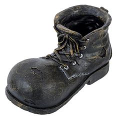 an old pair of black leather boots with holes and laces on the outstep