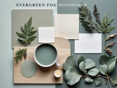 the green fog mood board is laid out with leaves and other things to use on it