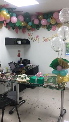 a party room with balloons, streamers and confetti