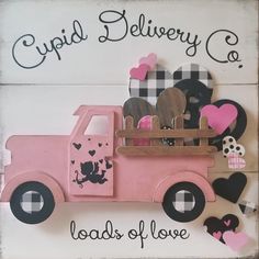 a pink truck with hearts in the back and words around it that read, cupid delivery co loads of love