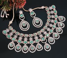 This exquisite Rose Gold American Diamond Mint Green/ Pink stone Wedding Choker Necklace and Earring Jewelry Set is designed with an Indian Bollywood style and features large stunning Mint Green pear shaped American Diamond stones to bring out the beauty in any outfit. Perfect for the most special occasions, this set will be sure to make a statement. Hand Set Rose Gold Bridal Necklace For Reception, Mint Green Wedding, Wedding Choker Necklace, Tikka Jewelry, Wedding Mint Green, Diamond Choker Necklace, Stone Wedding, Indian Jewelry Sets, Bollywood Style