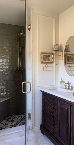 a bathroom with a walk in shower next to a sink