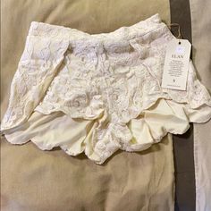 Brand New Never Worn Has Tags Off White Lace Shorts Size Small Elegant Short Bottoms For Brunch, Feminine Short Bottoms For Party, Elegant Short Pants For Summer, Elegant Short Summer Pants, Elegant Fitted Beach Shorts, Elegant Beach Shorts For Spring, Feminine Summer Party Bottoms, Elegant Short Bottoms For Vacation, Elegant Short Length Bottoms For Vacation