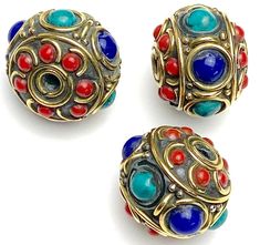 Large, 3/4" x 5/8" beads with round lapis, turquoise and coral stones, with shiny brass. Handmade in Nepal, possibly vintage, with handmade variance and natural stones so no two will exactly match. They are on the heavy side; .3 ounce each. Hole is about 2.25mm. $4.75 per bead. Limited supply. Bohemian Blue Oval Beads, Gems, And Cabochons, Multicolor Round Beaded Brass Jewelry, Artisan Blue Round Beads Gems And Cabochons, Large Bronze Round Beads, Artisan Blue Round Beads, Blue Bohemian Beads, Gems, And Cabochons, Blue Round Bohemian Beads, Gems And Cabochons, Blue Bohemian Round Beads Gems And Cabochons, Bohemian Lapis Lazuli Round Beads