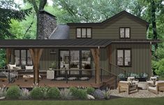 this is a computer rendering of a house in the woods with patio and covered porch