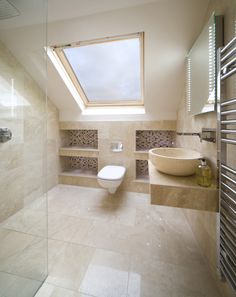 a bathroom with a skylight above the toilet