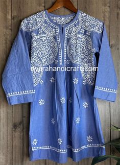 Unique denim look Chikankari hand embroidered a line blouse. Length: 30 inches Summer Long Sleeve Kurta With Motifs, Cotton Long Sleeve Tunic With Intricate Embroidery, Cotton Tunic With Intricate Embroidery And Long Sleeves, Long Sleeve Cotton Tunic With Intricate Embroidery, Spring Cotton Kurta With Motifs, Bohemian Spring Kurta With Motifs, Spring Bohemian Kurta With Motifs, Blue Embroidered Straight Kurta Top, Chikankari Embroidery Top For Festivals