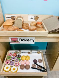 an assortment of baked goods on display in a bakery