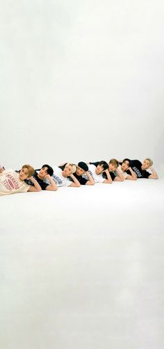 several people laying on their stomachs in a row