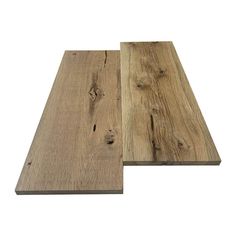 two pieces of wood sitting next to each other on top of a white background,