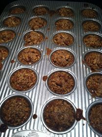 muffins are lined up in pans ready to be baked into the oven