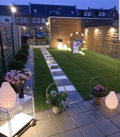 an outdoor garden with lights and flowers