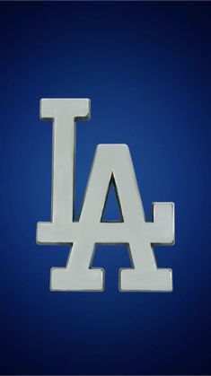 the los angeles dodgers logo is shown on a blue background in this image, it appears to be made out of plastic