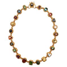 This multi -gemstone necklace by Santa Fe designer, Luna Felix is both arty and elegant. The twenty two links are a combination of round; oval; rectangular and triangular shapes. Among the stones are: moonstone; amethyst; garnet; citrine; aquamarine and various shades of tourmaline. Some stones are faceted; others are cabochon. Each is set with the Etruscan work gold beading characteristic of Felix's work. Her gold detailing is extraordinary. The necklace is 17 inches long and half an inch wide. Felix Jewelry, Felix Bulgari, Hand Jewelry Rings, Multi Gemstone Necklace, Colorful Necklace, Twenty Two, Gem Necklace, Gold Necklace Set, Classy Jewelry