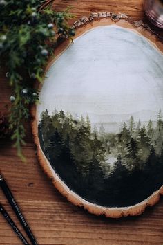 a painting is shown on a piece of wood