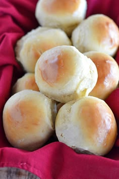 small rolls sitting on top of a red cloth