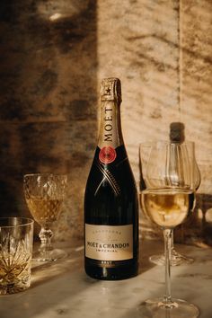 Champagne bottle on a bottle enlightened by the evening sun. Champagne Editorial, Champagne Gifts, Book Collage, Food Videography, Champagne Gift, Wine Photography, Divine Feminine Spirituality, Gourmet Gift Baskets, Drink Photo