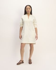 The Long-Sleeve Utility Mini Dress Cotton Mini Shirt Dress With Pockets, Relaxed Fit Cotton Mini Dress For Work, Relaxed Cotton Mini Dress For Work, Summer Workwear Cotton Tunic, Summer Cotton Tunic For Work, Relaxed Fit Knee-length Mini Dress For Work, Relaxed Fit Mini Dress With Pockets For Fall, Cotton Mini Dress With Side Pockets, Spring Workwear Fitted Tunic