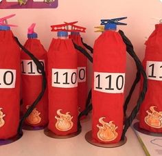 red fire extinguishers lined up on top of each other