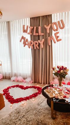 a valentine's day dessert table with cookies and cupcakes in the shape of a heart