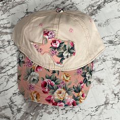 Nwt Boutique Texas Floral Baseball Cap Adjustable Strap Beautiful Distressed Floral Design And Texas State Outline In The Front Cream Color Casual Cotton Hats With Floral Print, Pink Floral Print Hat For Summer, Pink Floral Print Summer Hat, Casual Floral Print Cap, Spring Beige Baseball Cap, Pink Visor Hat For Spring, Pink Cotton Trucker Hat For Spring, Pink Curved Brim Baseball Cap For Spring, Casual Pink Adjustable Baseball Cap