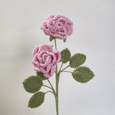 two crocheted pink roses in a vase